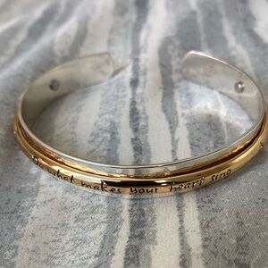 Bracelet with inscribing: “Do what makes your heart sing”